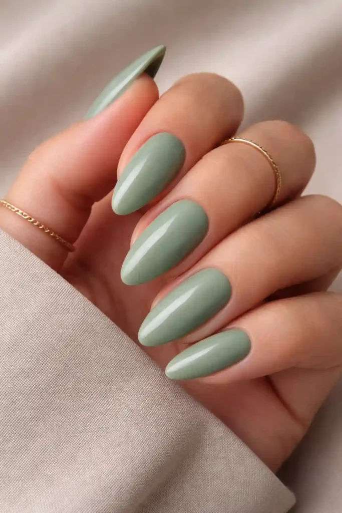 Sage green minimalist almond nails with matte earthy finish
