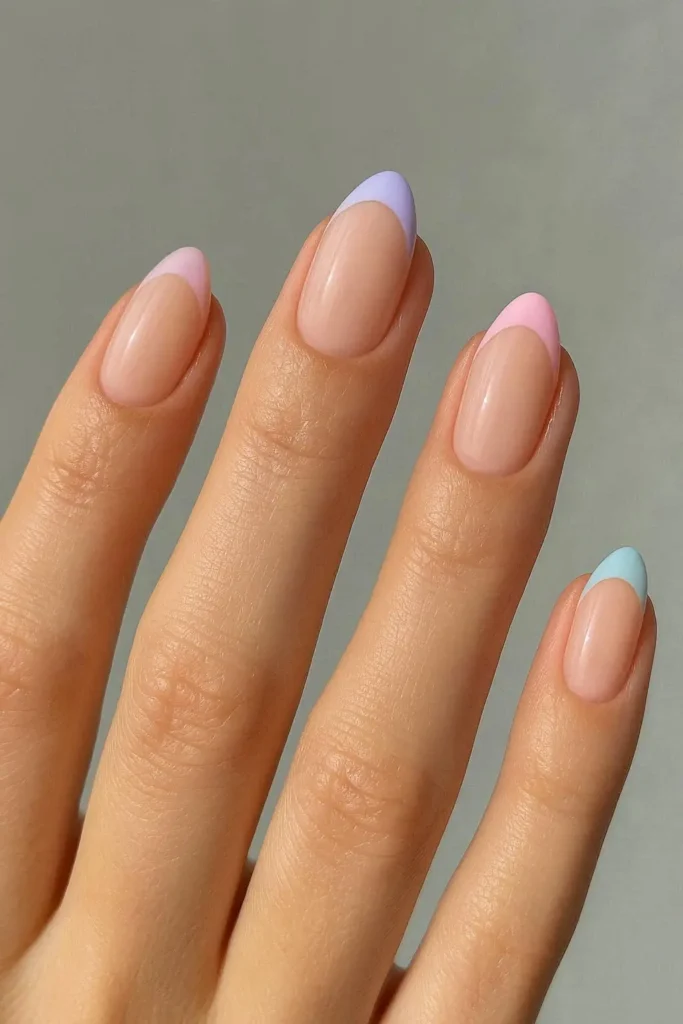 Spring French tip nails with soft lavender pastel tips on a sheer nude base