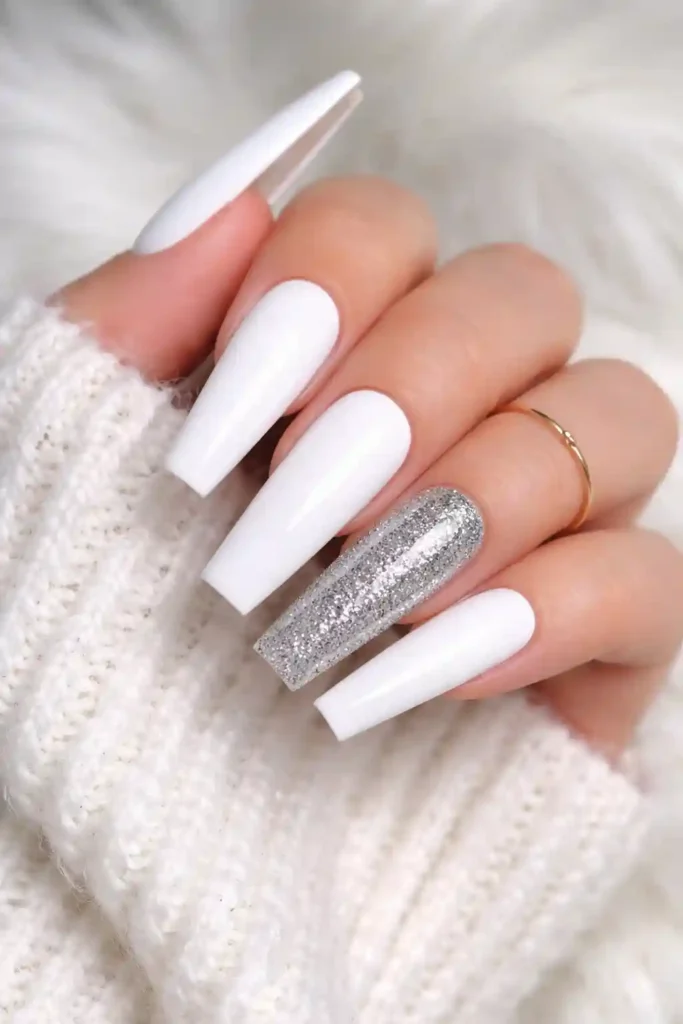 White coffin nails with a bold glossy finish on long flat-tipped coffin nails