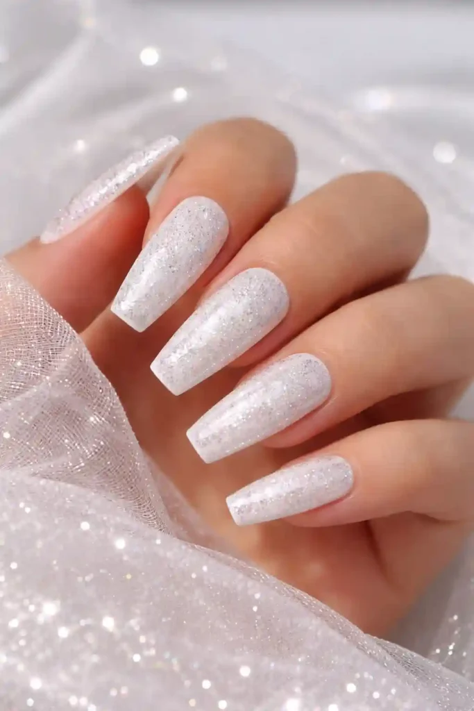 White glitter nails with holographic chunky glitter on square nails