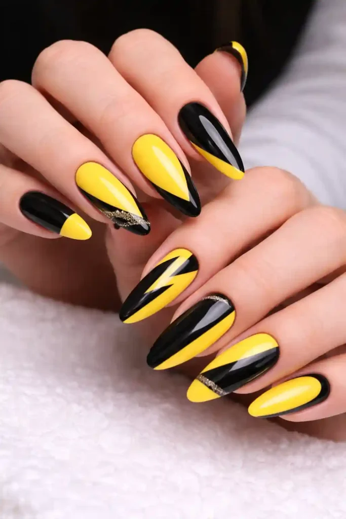 Yellow and black contrast nail art design

