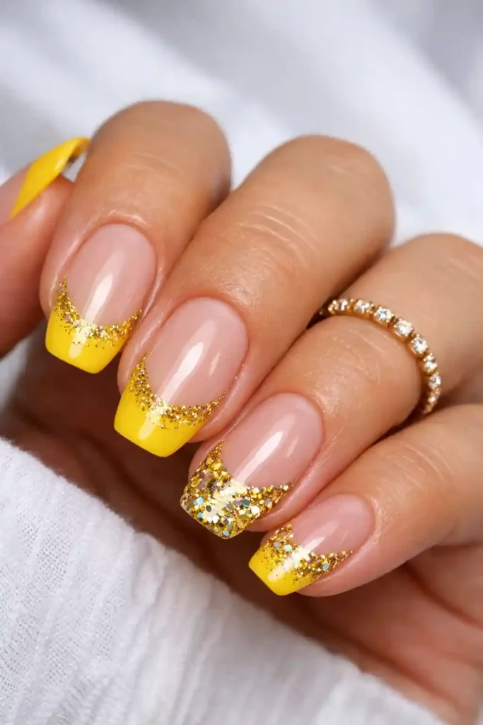 Yellow French tips with gold glitter
