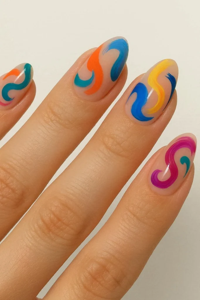 abstract art nails with fluid brushstroke swirl designs in bold colors