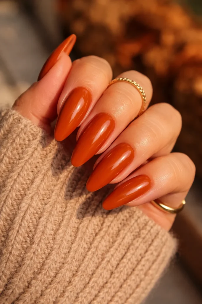 Burnt orange glossy September nails for fall transition