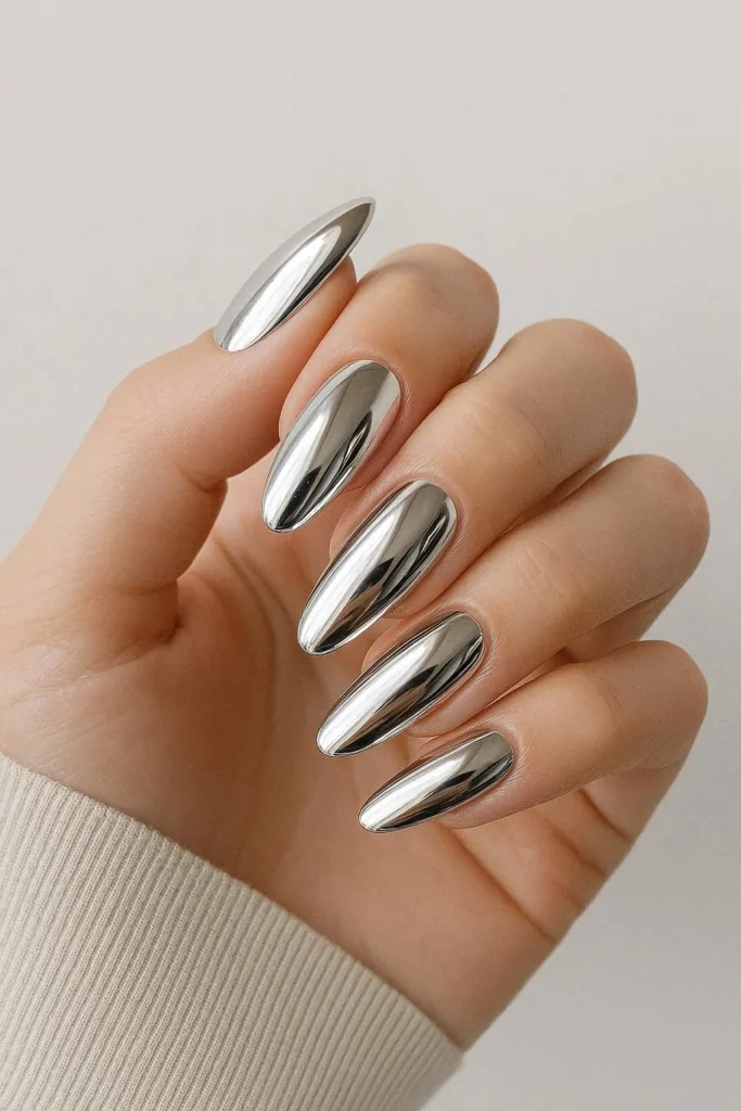 chrome mirror nails with ultra-reflective liquid metal finish on almond shape