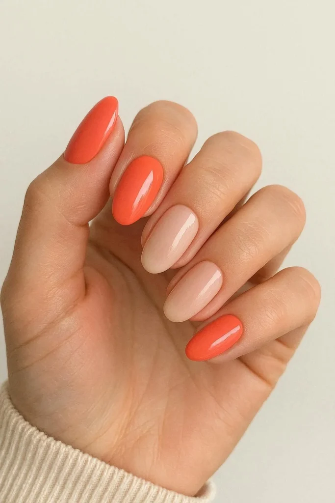 Color-blocked coral and nude combo nails for a chic look