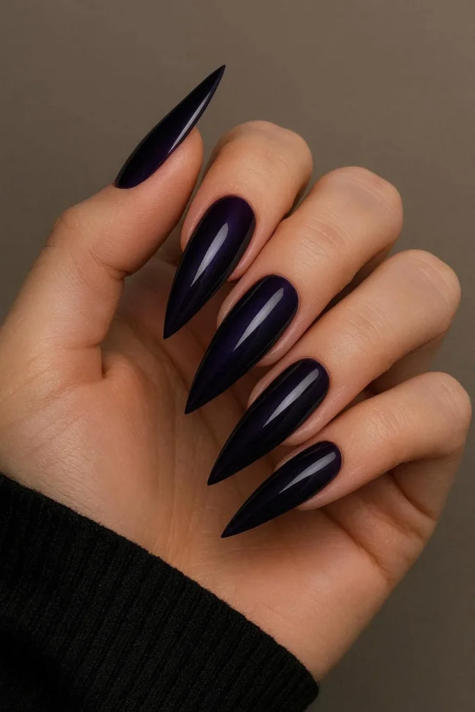 Dark purple stiletto nails in rich plum and deep violet 
