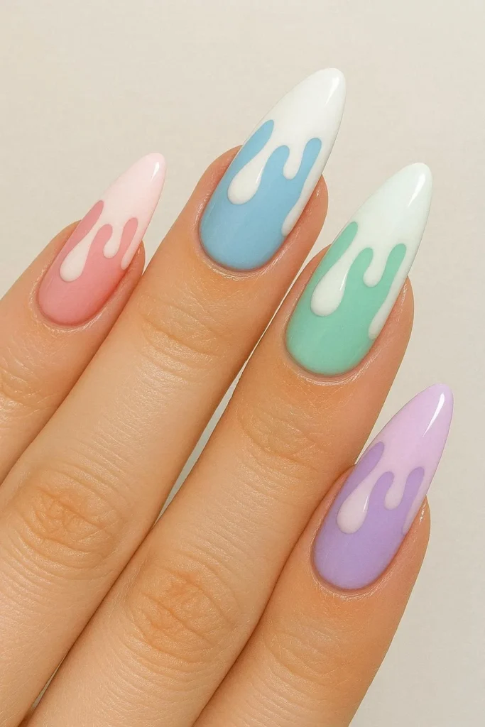 Drip effect nails with glossy painted color drips over contrasting base