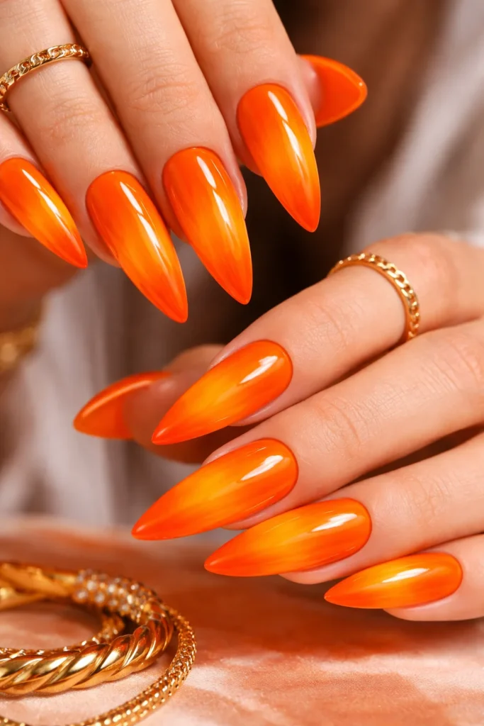 Fiery orange Leo nails glossy and vibrant for summer
