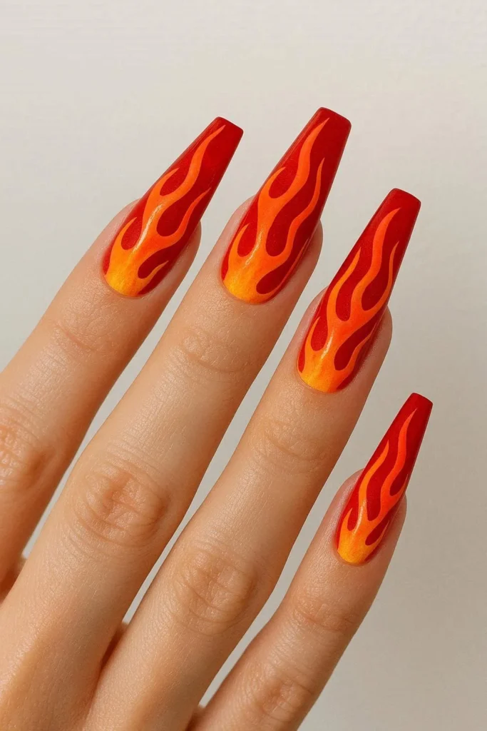 fire flame nails with bold red orange and neon yellow flame nail art