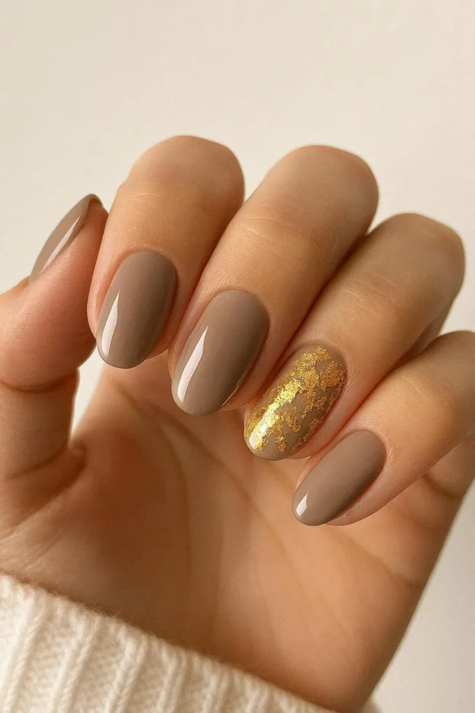 Neutral nails with delicate gold foil autumn accent details