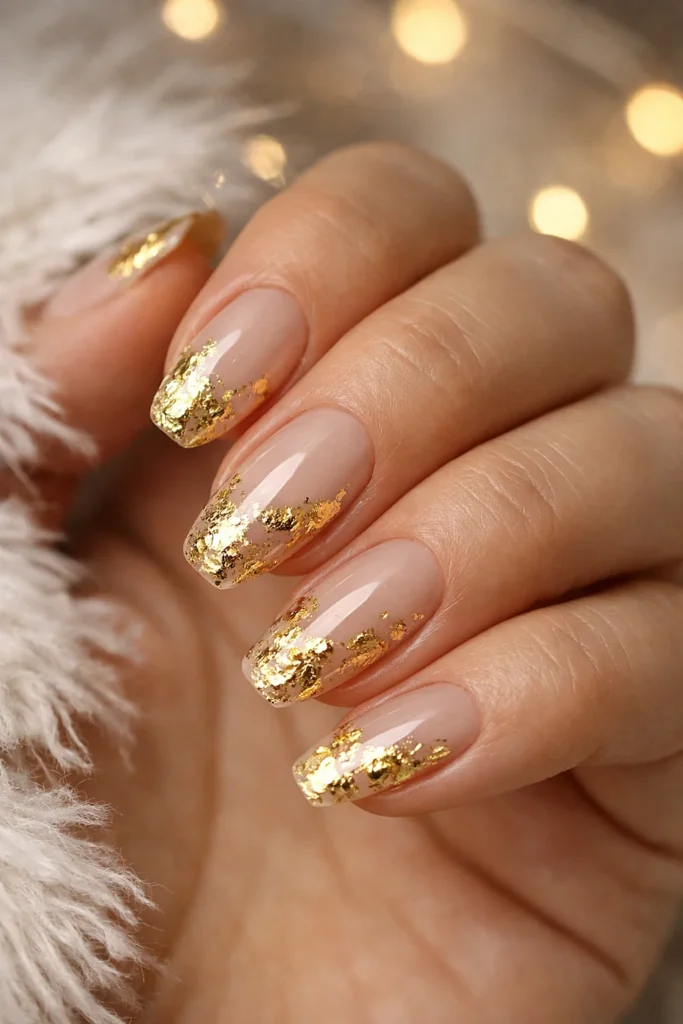 Gold foil accent nails on nude base elegant winter manicure