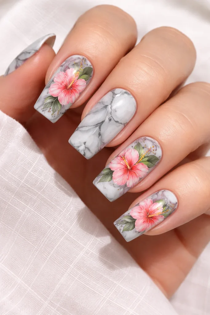 Hibiscus flower nails with marble effect elegant floral nail art 