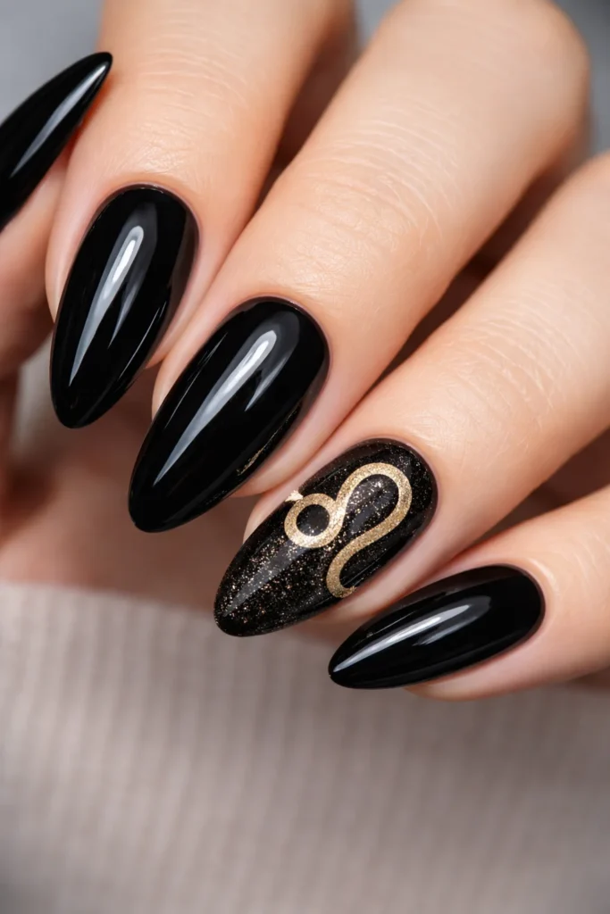 Leo zodiac symbol nails with gold glyph on nude base