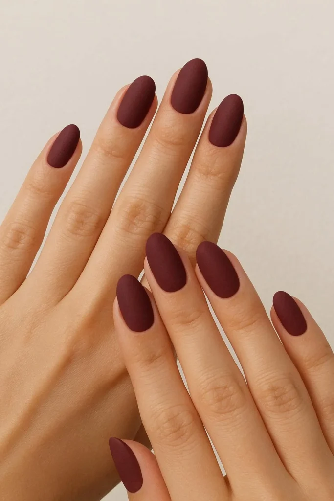 Matte burgundy nails with a soft velvety fall finish
