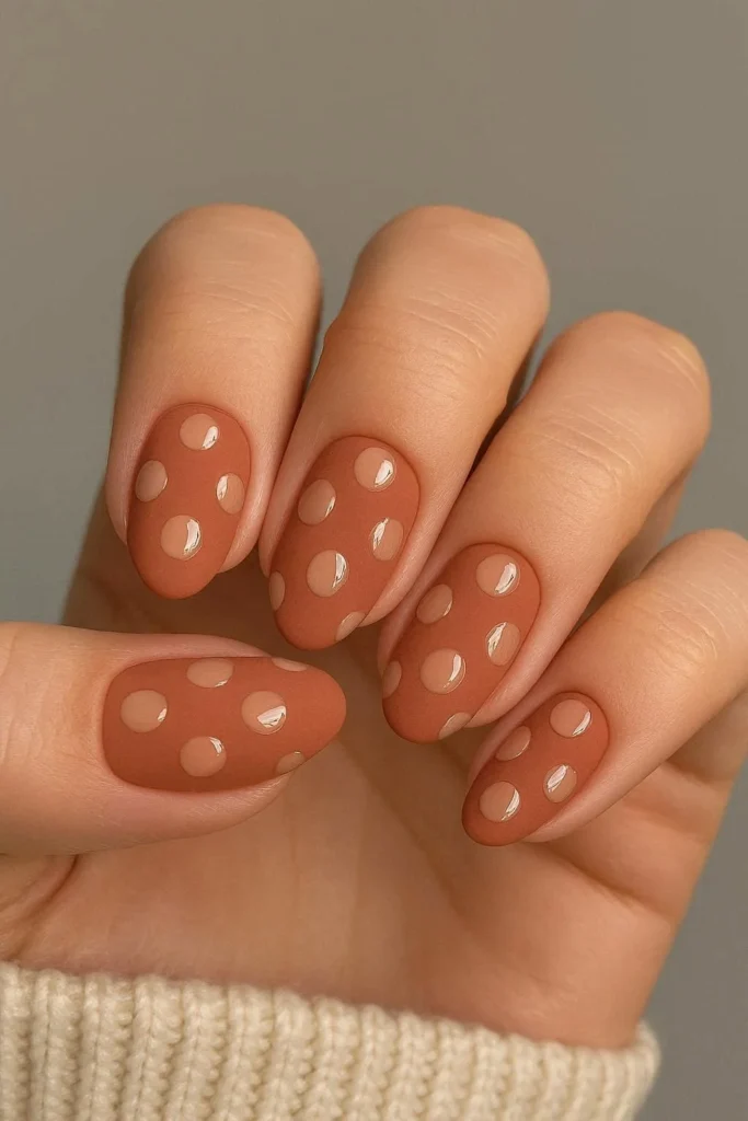 Matte finish nails with glossy polka dots textural contrast 
