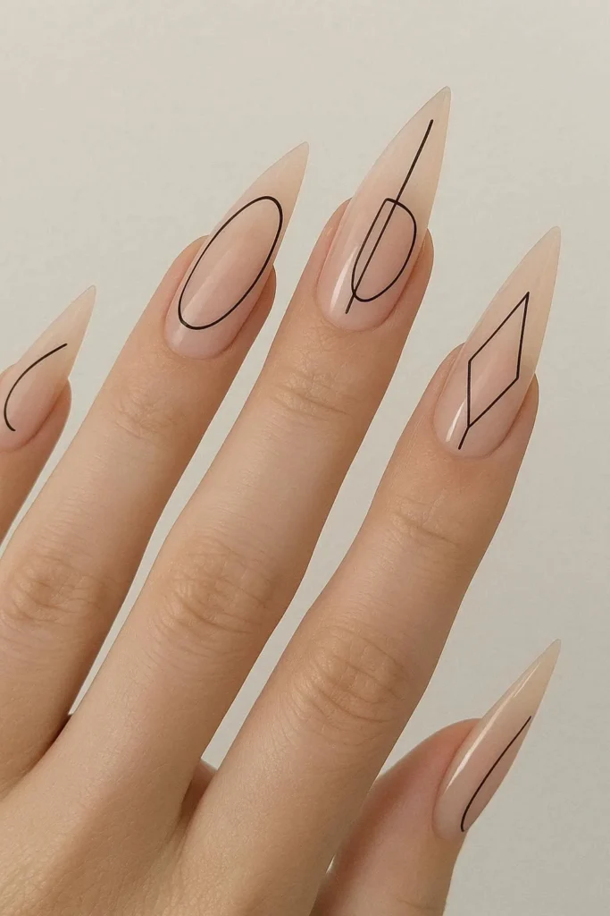 Minimal line art stiletto nails with fine strokes on nude 