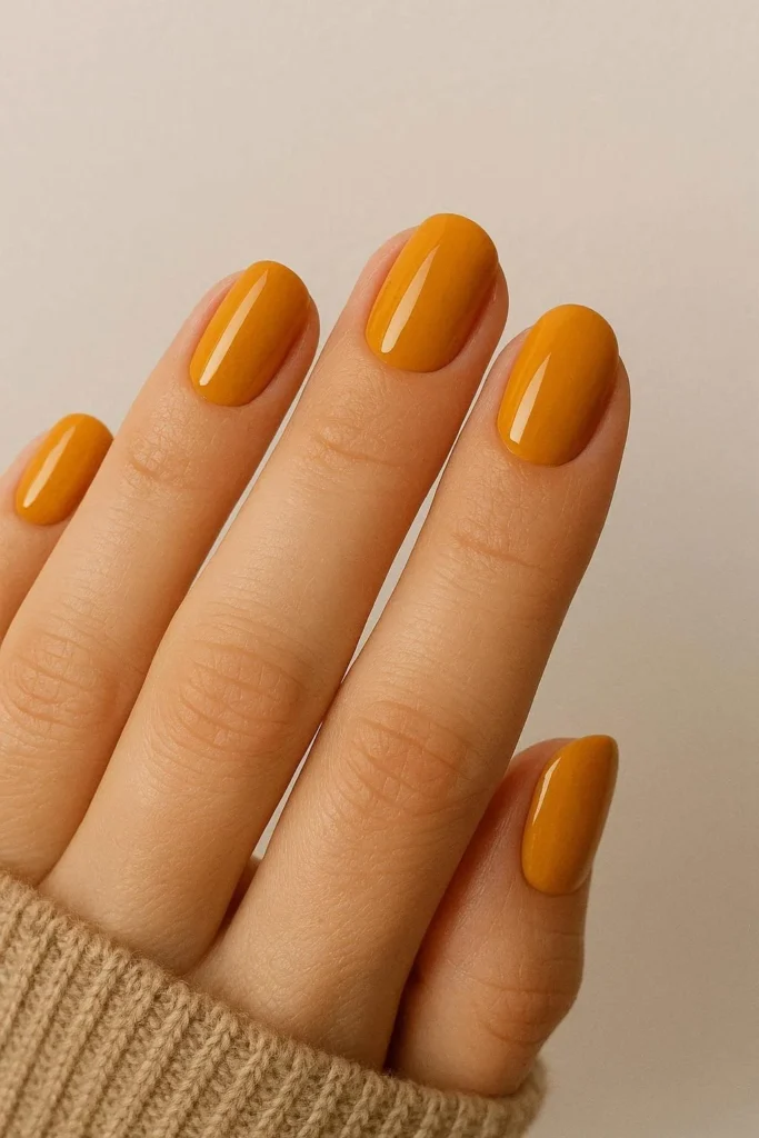 Bold mustard yellow nails for a warm fall statement