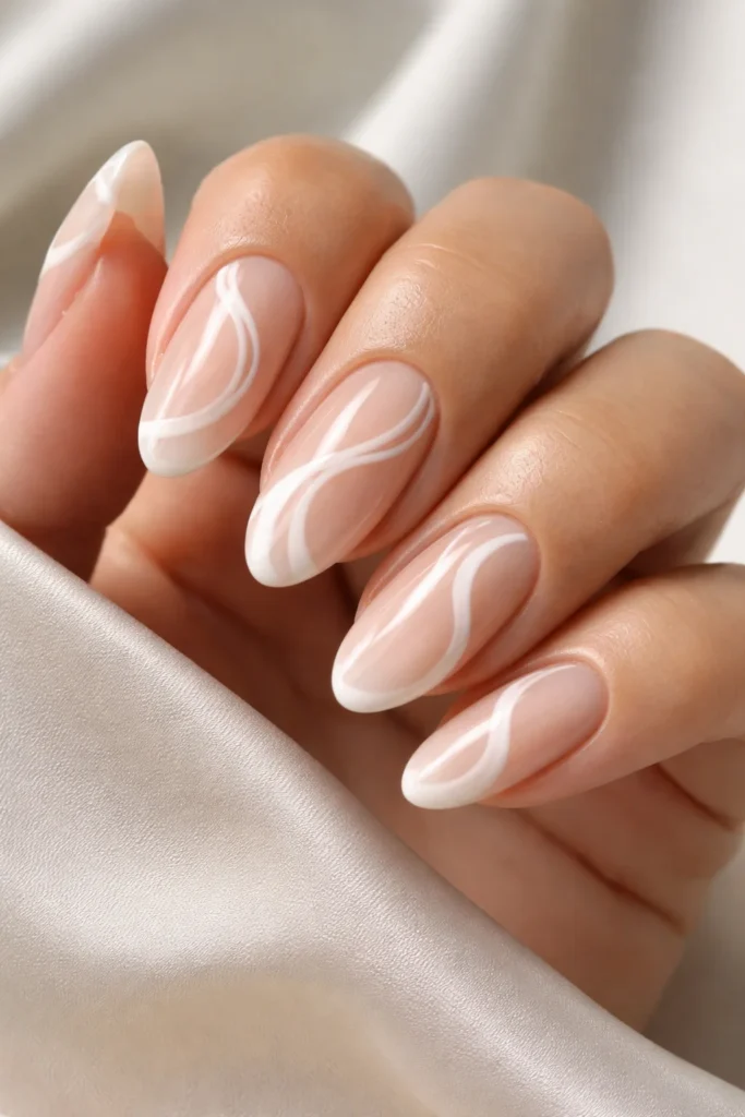 Nude and white swirl nail design for fall 