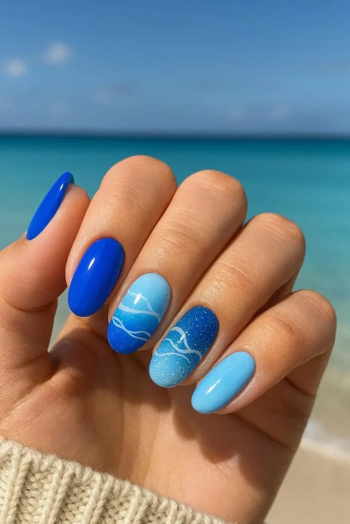 Ocean blue beach nail ideas with deep and light blue shades
