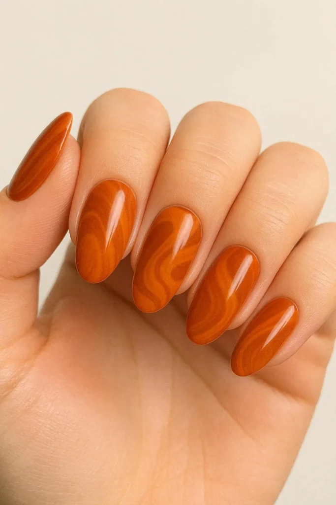 Orange and brown pumpkin spice nails for autumn season