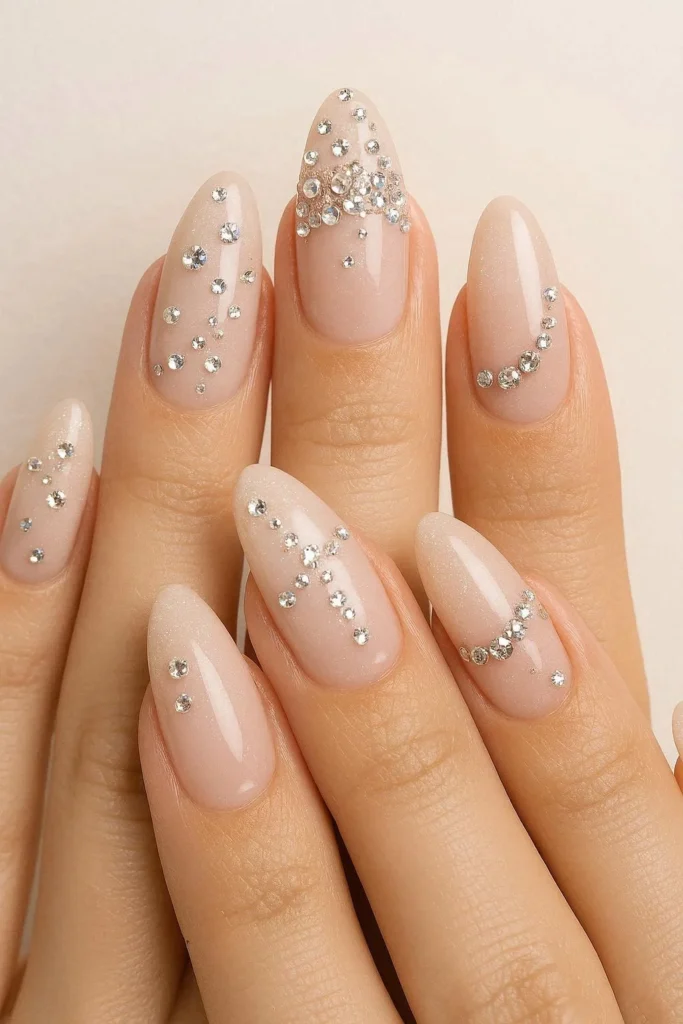rhinestone glam nails with sparkling crystal stone embellishments on nude base