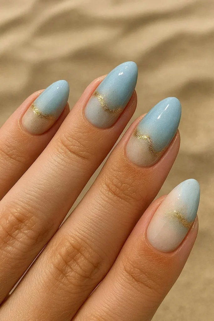 Seashell accent beach nail ideas with gold shimmer coastal details