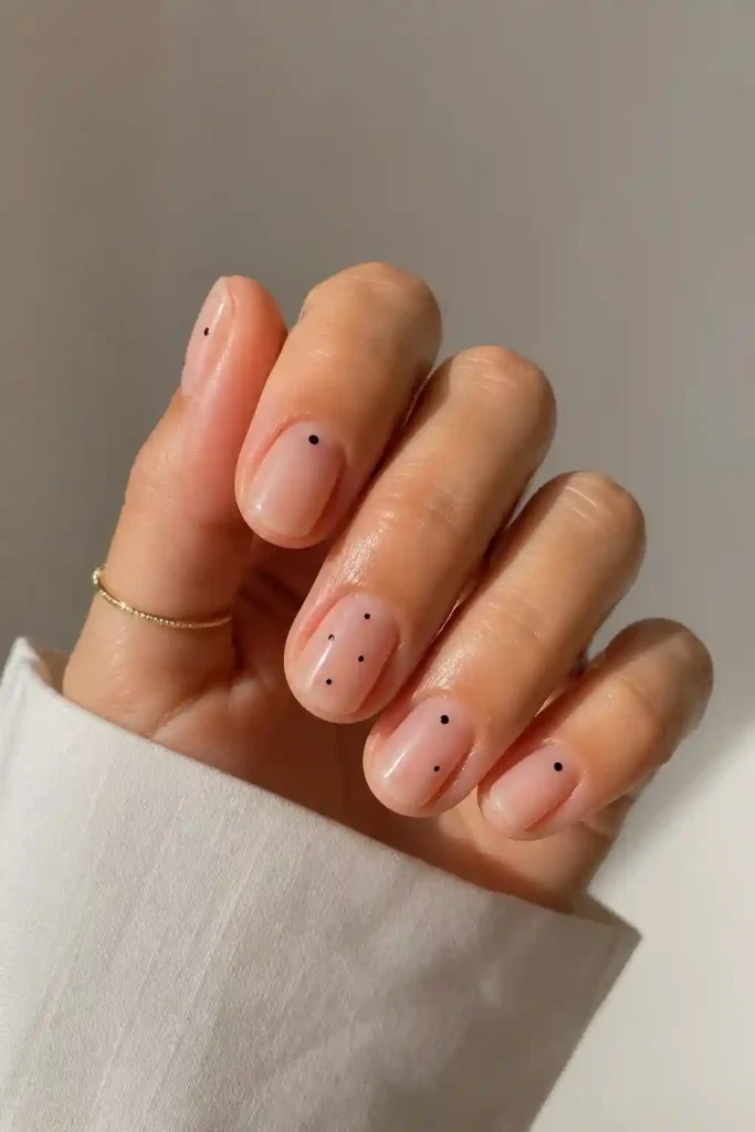  Short minimal dot nails with tiny dot accents on nude base