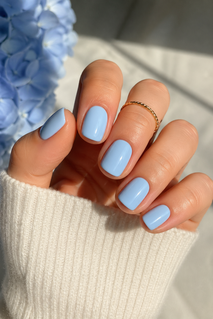 Short soft blue nails in a light powder blue shade