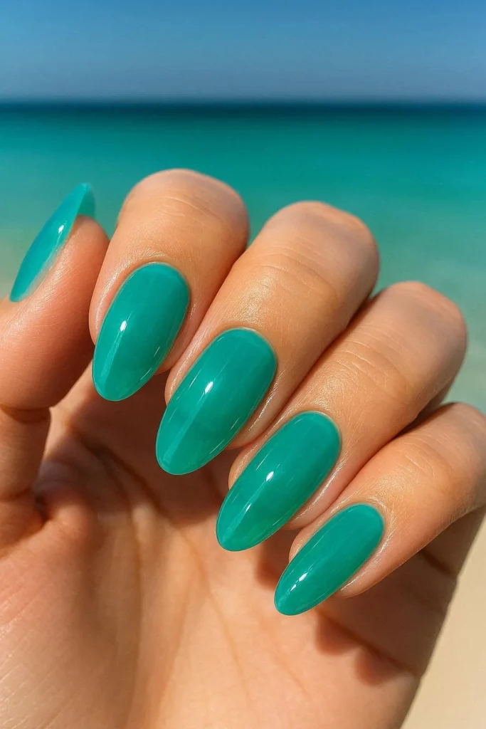 Turquoise beach nail ideas in bright tropical jelly finish