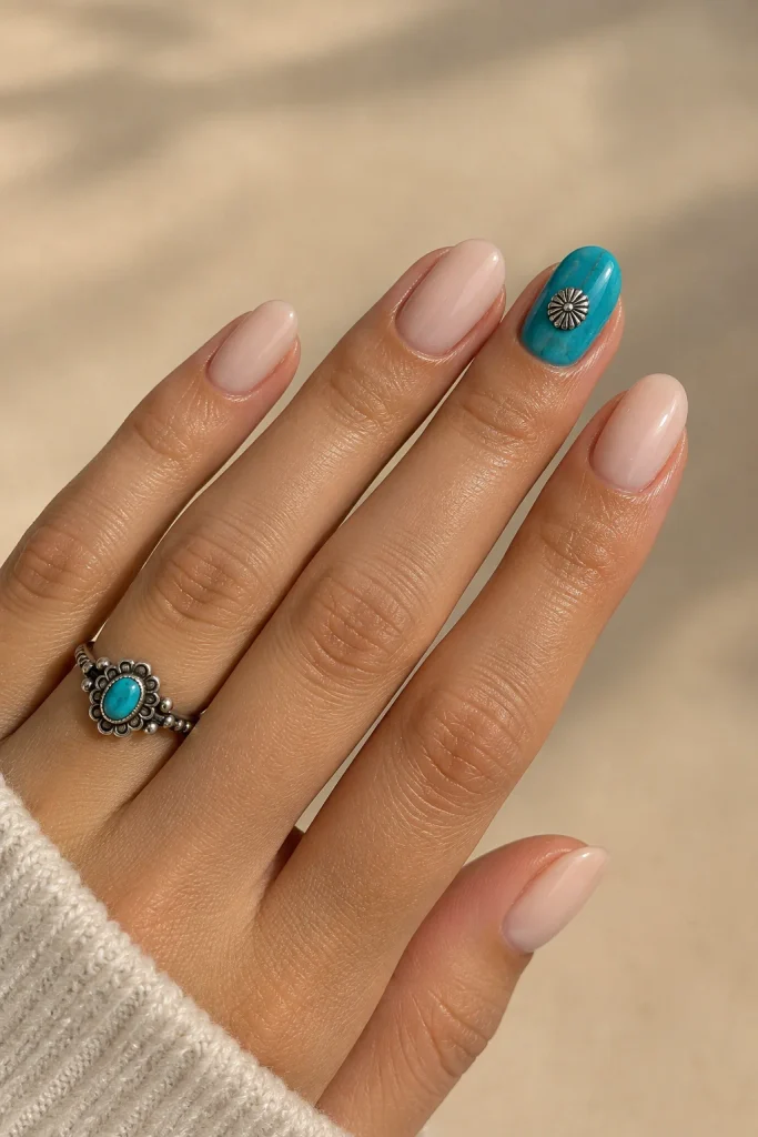 Nude Western nails with turquoise accents and silver concho studs