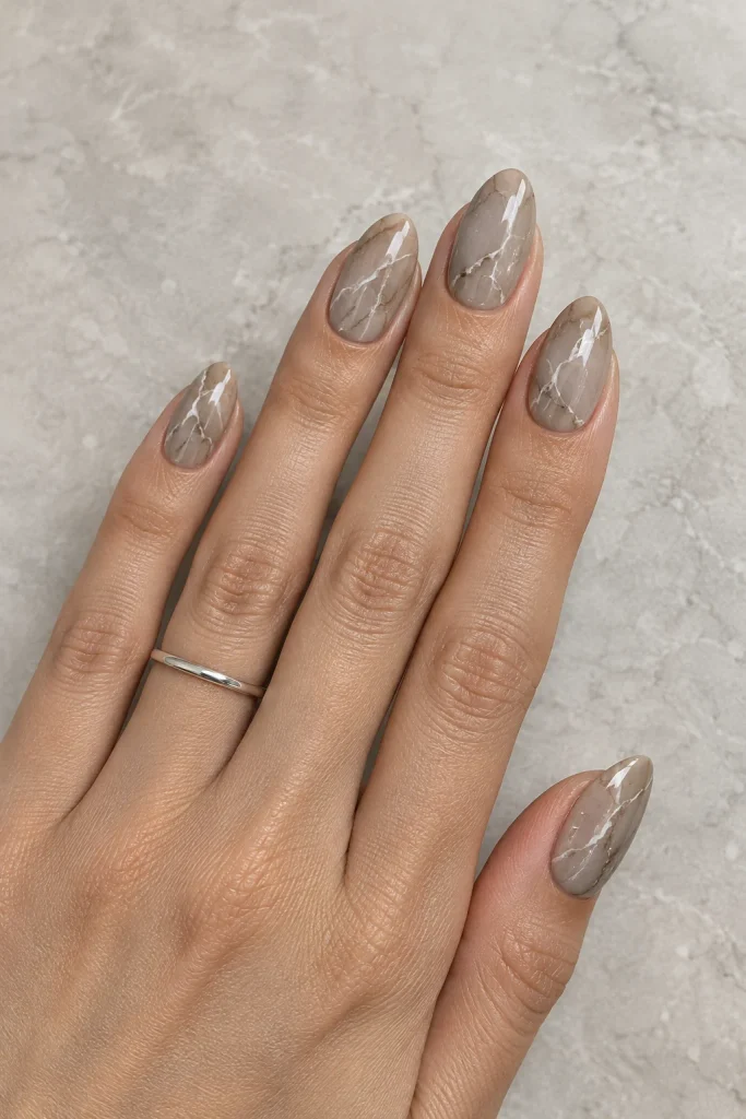 Warm stone gray nails with soft marble veins