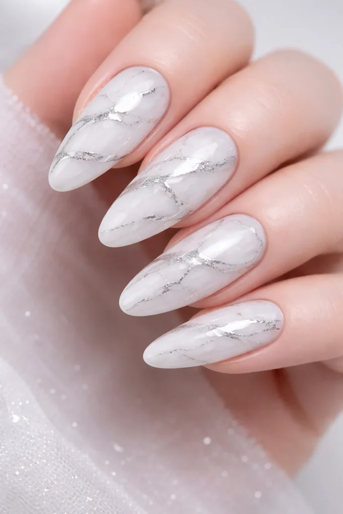 White and silver marble nails elegant shimmer winter nail design