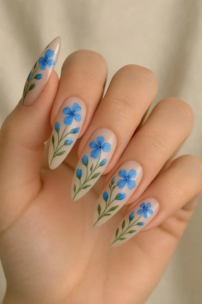 Almond shaped nails with elegant blue floral nail design