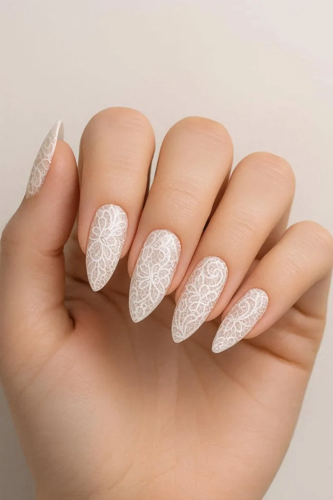  Elegant almond shaped nails with intricate delicate lace nail art 