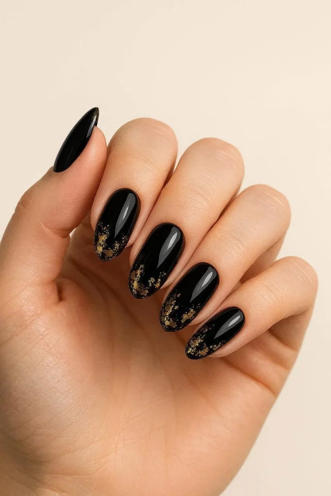 Black and gold graduation nails for a sophisticated formal look