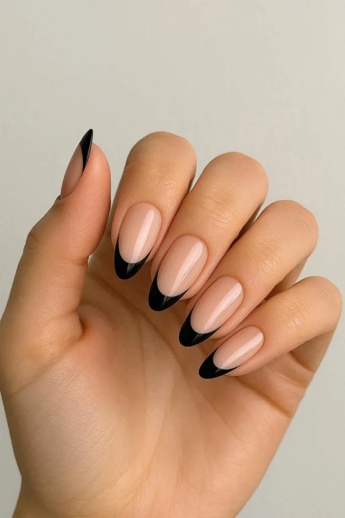 Black French tip nails on nude base for fall