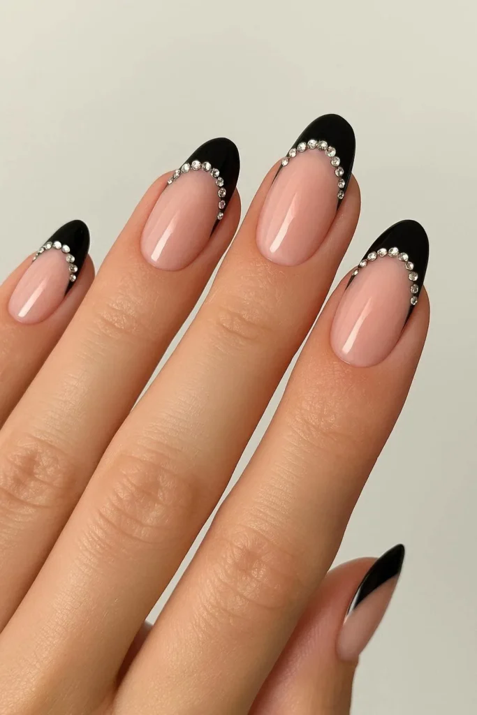 Black French tip nails with crystal rhinestone smile line