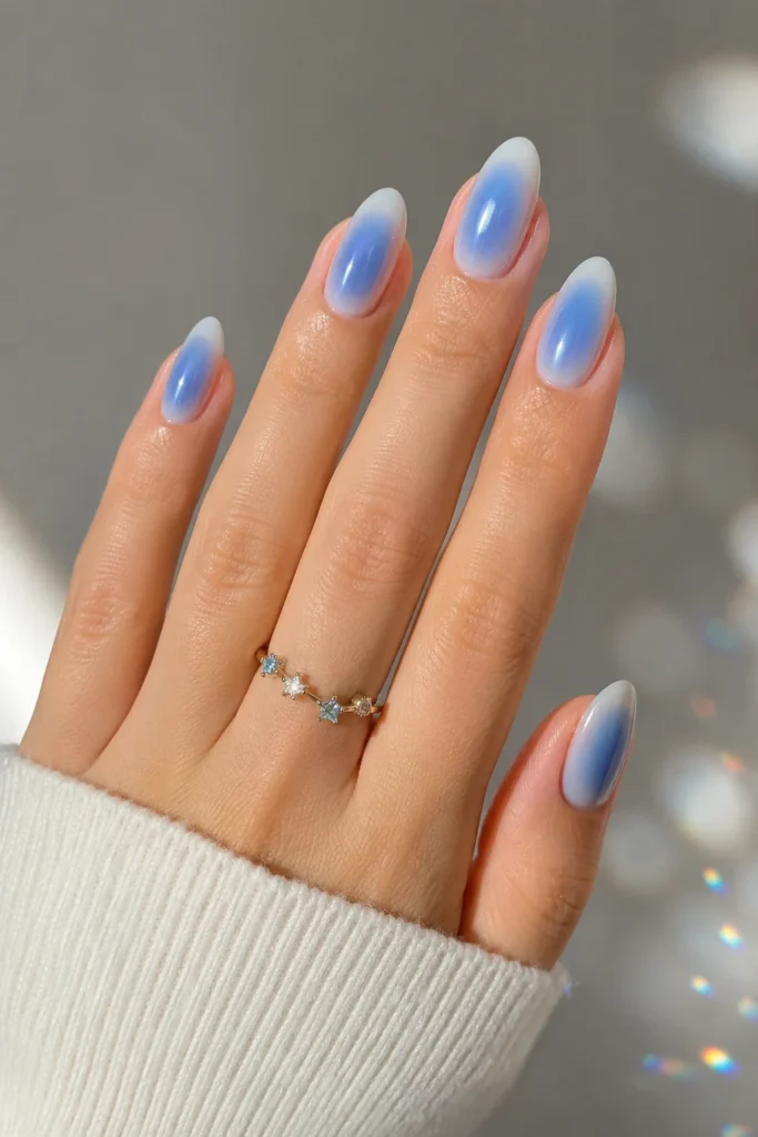 Blue aura Gemini nails with soft dreamy blended blue shades 