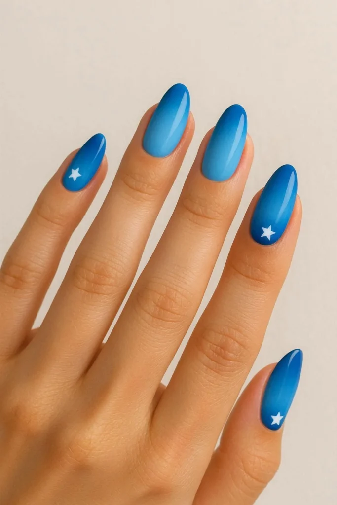 Blue ombre nails with sky to navy gradient for summer