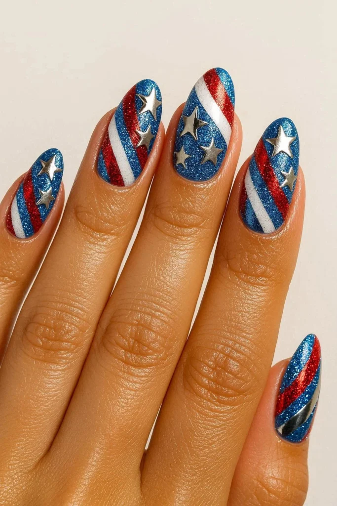 Bold festival style nails with stars glitter and patriotic colors