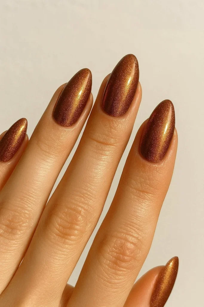 Bronze shimmer almond nails warm copper glow Italian inspired