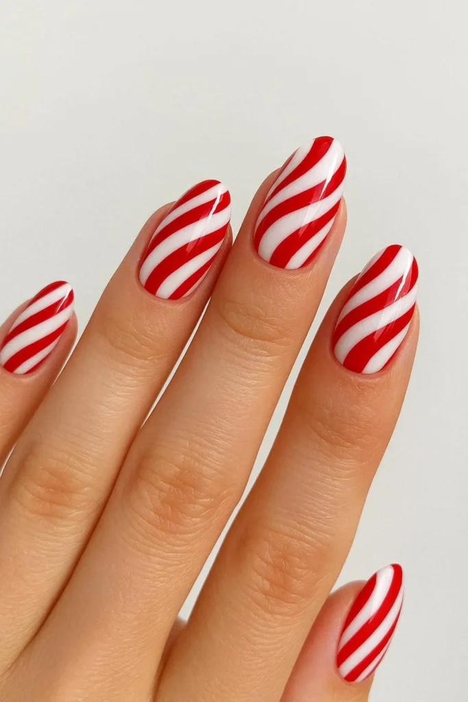 Candy cane swirl Christmas nails in red and white