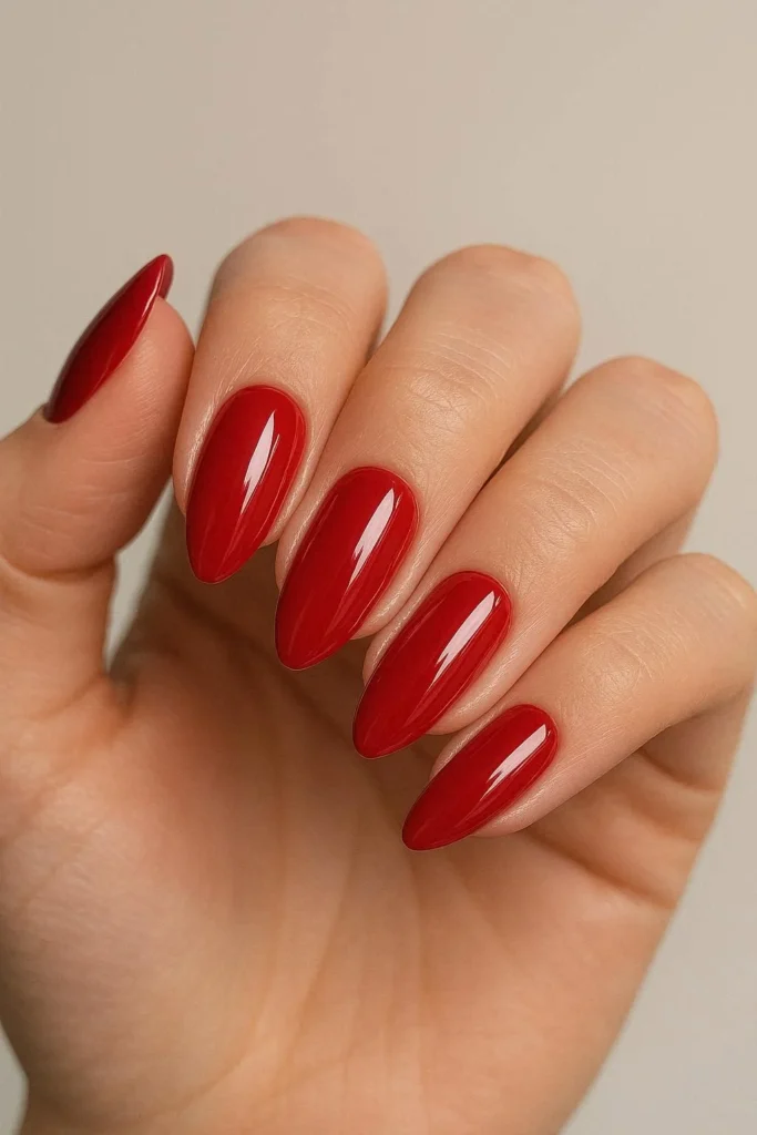 Cherry red gloss nails for bold homecoming dance night 