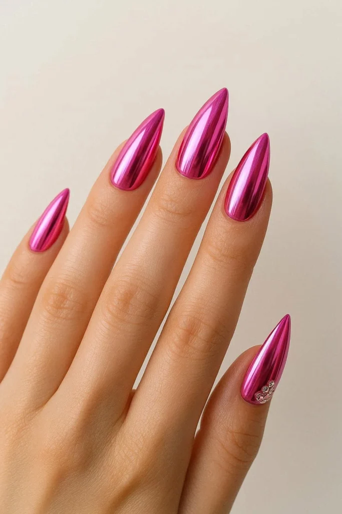 Reflective chrome pink nails with futuristic Y2K vibe