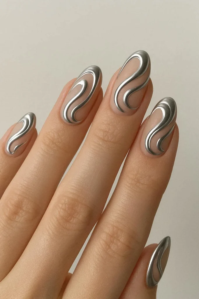 Chrome swirl nail art with metallic reflective design