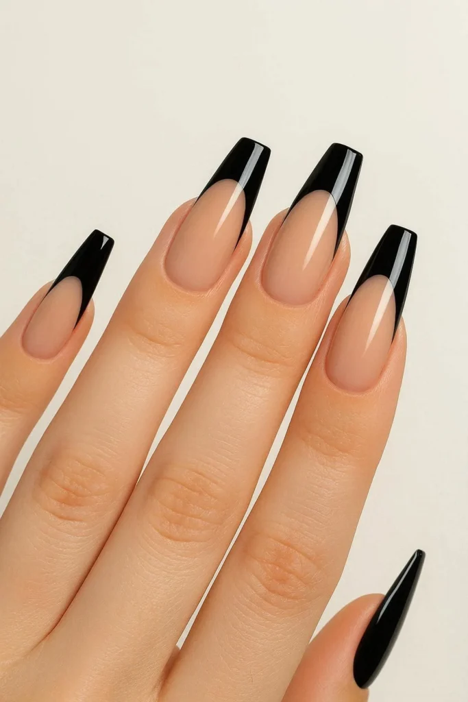 Coffin shaped black French tip nails in bold design