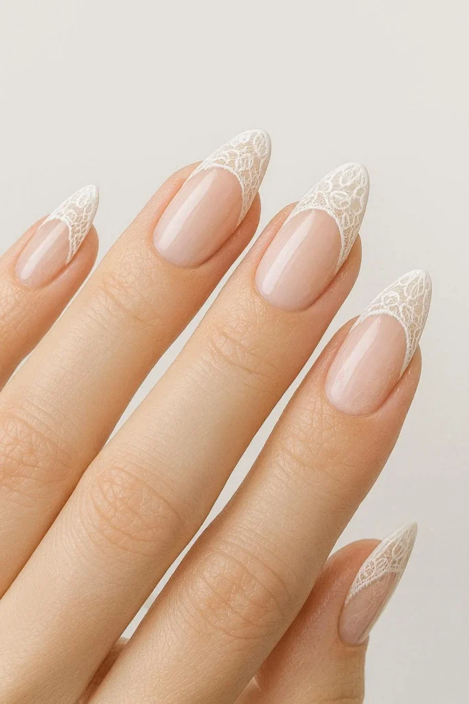 Classic French tip nails with intricate delicate lace accents