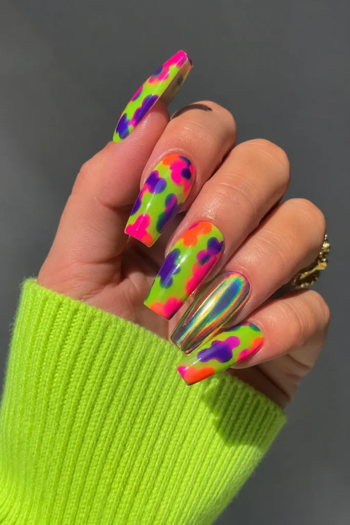 Funky cow print nails in neon green and multicolor on coffin shape