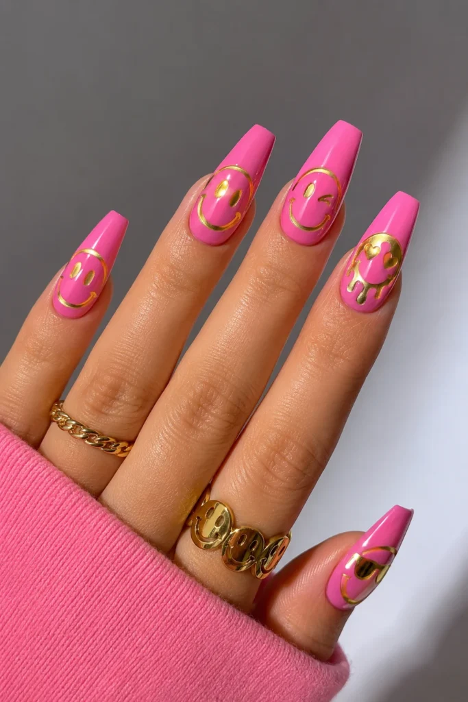 Funky smiley face nails in yellow and black on coffin shape